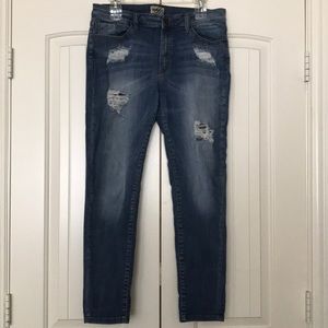 Medium wash distressed denim stretchy skinny jeans